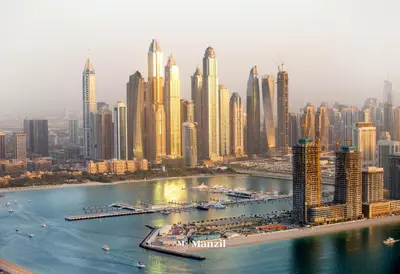 an aerial view of a city with tall buildings at Manzil - 1BR Apartment in Emaar Beachfront with Private Beach & Marina Access in Dubai