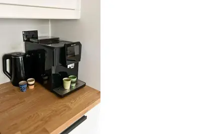 a coffee maker sitting on a counter in a kitchen at FavDubai presents 2BR apartment in The Heart of JBR and Dubai Marina 150 m to JBR Beach with famous Ain Dubai view the biggest ferris wheel in the world Swimming pool access, air-conditioned gym, free parking & Housekeeping in Dubai