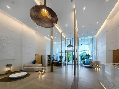 a lobby of a building with chairs and tables at Panoramic sea view from new 2BD in La Vie JBR in Dubai