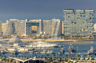 a large city with boats in the water and buildings at Panoramic sea view from new 2BD in La Vie JBR in Dubai