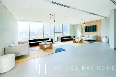 a living room filled with furniture and a large window at LUX The Downtown Zabeel View Suite 2 in Dubai