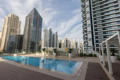 a large swimming pool in a city with tall buildings at Stella Maris High Floor,Stunning Skyline Views in Dubai