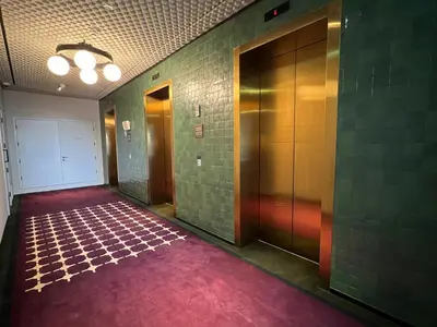 an empty hallway with a red carpet and a door at UPSIDE LIVING Downtown Business & Leisure in Dubai