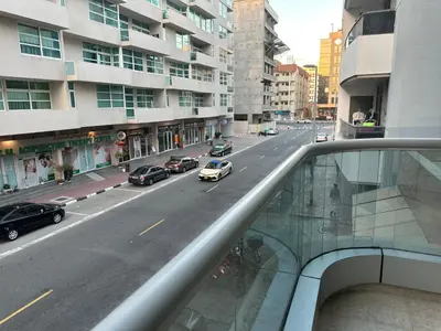a view of a city street with cars on the road at Fancy Partition Room Near Mashreq Metro / SZ Road in Dubai