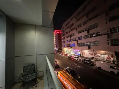 a view of a city street at night with cars at Fancy Partition Room Near Mashreq Metro / SZ Road in Dubai