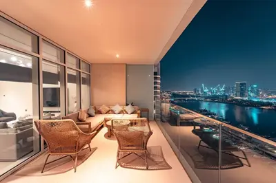 a living room with a view of a city skyline at FIRST CLASS 3BR with Dubai Marina & Palm View in Dubai