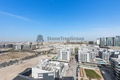 an aerial view of a city with tall buildings at StoneTree - Brand New Studio in Jewelz Residence in Dubai