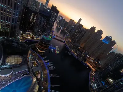 an aerial view of a city at night at Seaview & Marina View Studio in Dubai