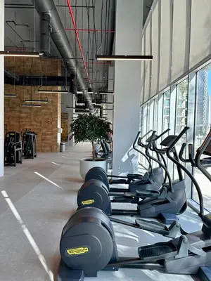 a gym with a row of exercise bikes in a room at Daniels Luxury 3BR with Dubai Opera Views in Dubai