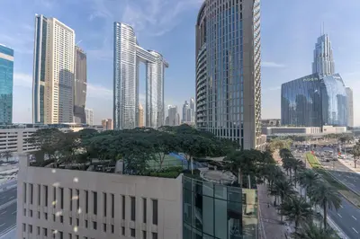 a view of a city with tall buildings at Close to Metro - Classic 2BR in Loft East,Downtown in Dubai
