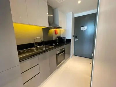 a kitchen with a sink and a counter top at Damac Prive l Canal View l Great Location in Dubai