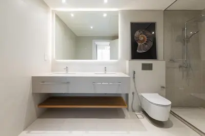 a bathroom with a sink and a toilet and a mirror at LUXSeaside/2BD/LaVie/JBR in Dubai
