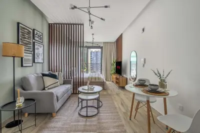 a living room with a couch and a table at GuestReady - A fantastic home in Business Bay in Dubai