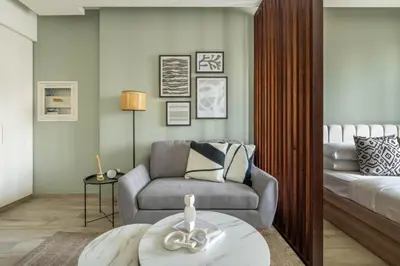 a living room with a chair and a couch at GuestReady - A fantastic home in Business Bay in Dubai