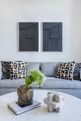 a living room with a couch and a table at Frank Porter - Riviera 27 in Dubai