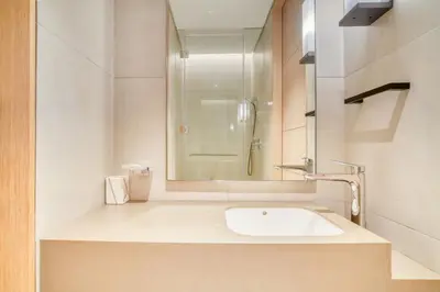 a white bathroom with a sink and a shower at Address JBR Marina View, JBR, Dubai Marina - Mint Stay in Dubai