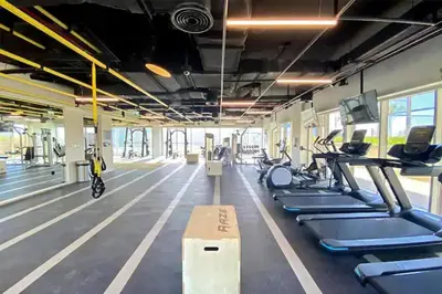 a gym with cardio machines and treadmills at Dream Tower 1 in Dubai