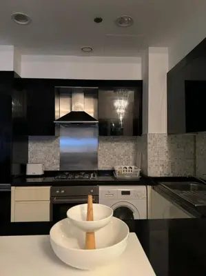a kitchen with a bowl on top of a counter at Elegant 1BR in Downtown, Close to Dubai Mall in Dubai