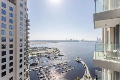 a view of a river between two buildings at Frank Porter - The Grand in Dubai