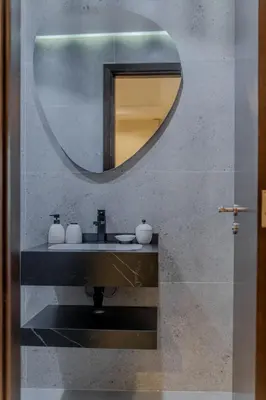 a bathroom with a sink and a mirror at Clever Guest Concorde JLT in Dubai