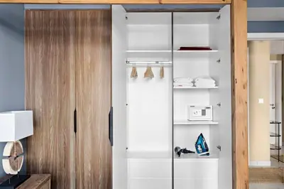 a room with a closet with a glass door at StoneTree - Cozy 1 BR near Madinat Jumeirah and Burj Al Arab in Dubai