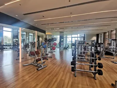 a gym with lots of treadmills and machines at Vacay Lettings - Burj Vista Tower 1- Direct Dubai Mall Access in Dubai