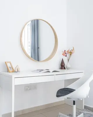 a white desk with a mirror and a chair at GuestReady - Comfort Stay l Close To Marina Mall in Dubai