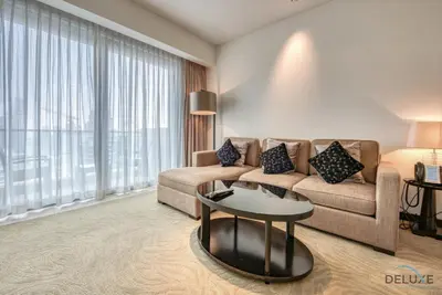 a living room with a couch and a table at Posh 1BR at The Address Residences Dubai Marina by Deluxe Holiday Homes in Dubai