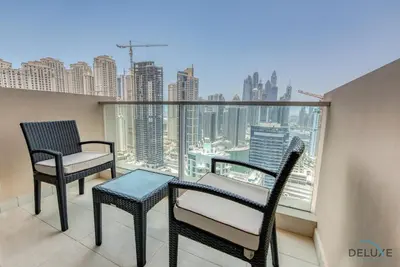 two chairs and a table on a balcony with a view at Posh 1BR at The Address Residences Dubai Marina by Deluxe Holiday Homes in Dubai