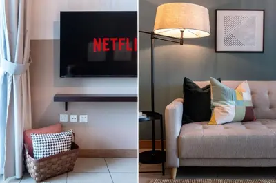 a living room with a couch and a television at GuestReady - The Reflections at Dubai Marina in Dubai