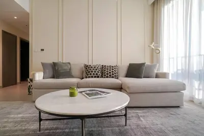 a living room with a couch and a coffee table at Your Elegance at Creek Harbour l 2BR in Dubai