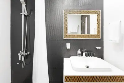 a bathroom with a sink and a mirror at Our Studio Jewel in Business Bay in Dubai