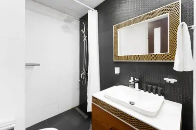 a bathroom with a white sink and a mirror at Our Studio Jewel in Business Bay in Dubai
