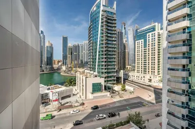a view of a city with a river and buildings at GuestReady - Bright 1BR with Balcony & Marina View in Dubai
