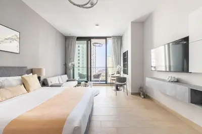 a bedroom with a large bed and a large window at Ultra Luxury Dubai Marina I LIV Residence in Dubai