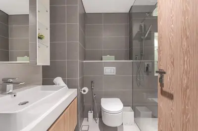a bathroom with a sink and a toilet and a shower at Ultra Luxury Dubai Marina I LIV Residence in Dubai