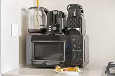 a microwave sitting on top of a counter at Silkhaus High Floor 1BDR with View with Pool & Gym in Dubai