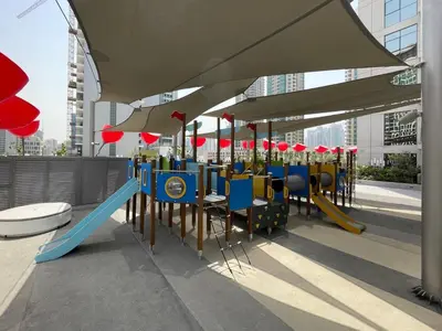 a playground with a blue slide and a blue slideintend at GuestReady – Downtown Studio l City View l Balcony in Dubai