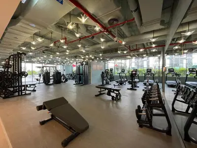 a gym with a lot of treadmills and machines at GuestReady – Downtown Studio l City View l Balcony in Dubai