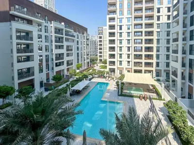 an overhead view of a swimming pool with buildings at HAVN - 2 Bedroom in Bayshore, Dubai Creek Harbour in Dubai