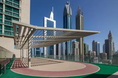 a pavilion with a view of a city with tall buildings at GuestReady- Holiday Homes - Cyan Sky View in Dubai