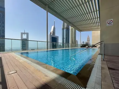 a swimming pool on the top of a building at GuestReady- Holiday Homes - Cyan Sky View in Dubai