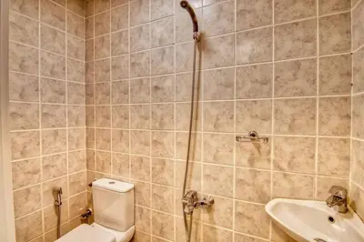 a bathroom with a shower and a toilet and a sink at The Smart Concierge - Avant in Dubai