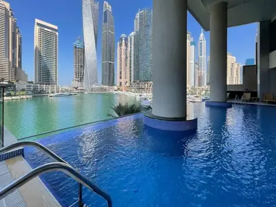a swimming pool with a view of a city at The Smart Concierge - Avant in Dubai
