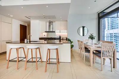 a kitchen and dining room with a table and chairs at Luxurious apartment in Dubai Marina in Dubai