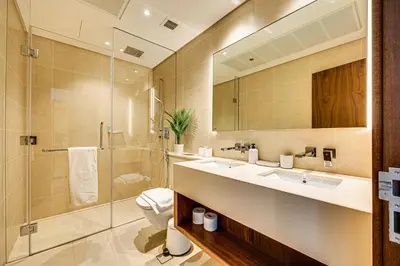 a bathroom with a shower and a sink and a toilet at Luxurious apartment in Dubai Marina in Dubai