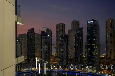 a view of a city skyline at night at LUX The Vida Marina Residence 3 in Dubai