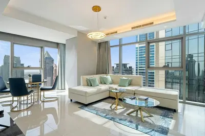 a living room with a couch and a table at High Floor 2 Bedroom Gem - Burj Khalifa Views in Dubai