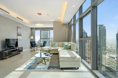 a living room with a couch and a table at High Floor 2 Bedroom Gem - Burj Khalifa Views in Dubai