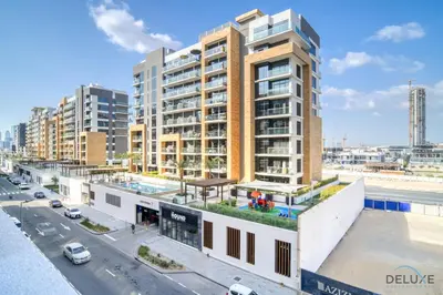 an overhead view of a building with a street at Beautiful Studio at Azizi Riviera 17, Al Merkadh by Deluxe Holiday Homes in Dubai